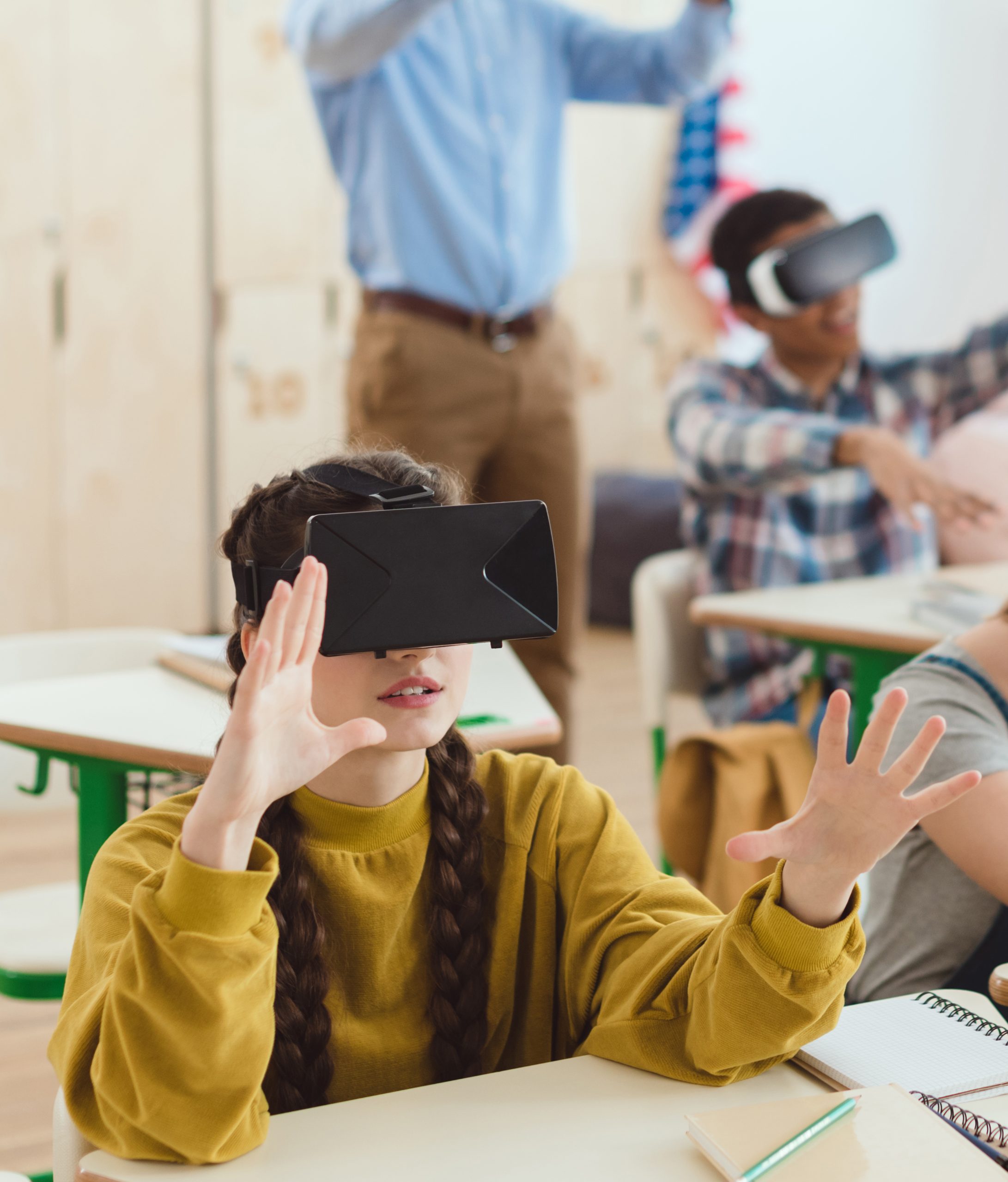 High school teenage students using virtual reality headsets 